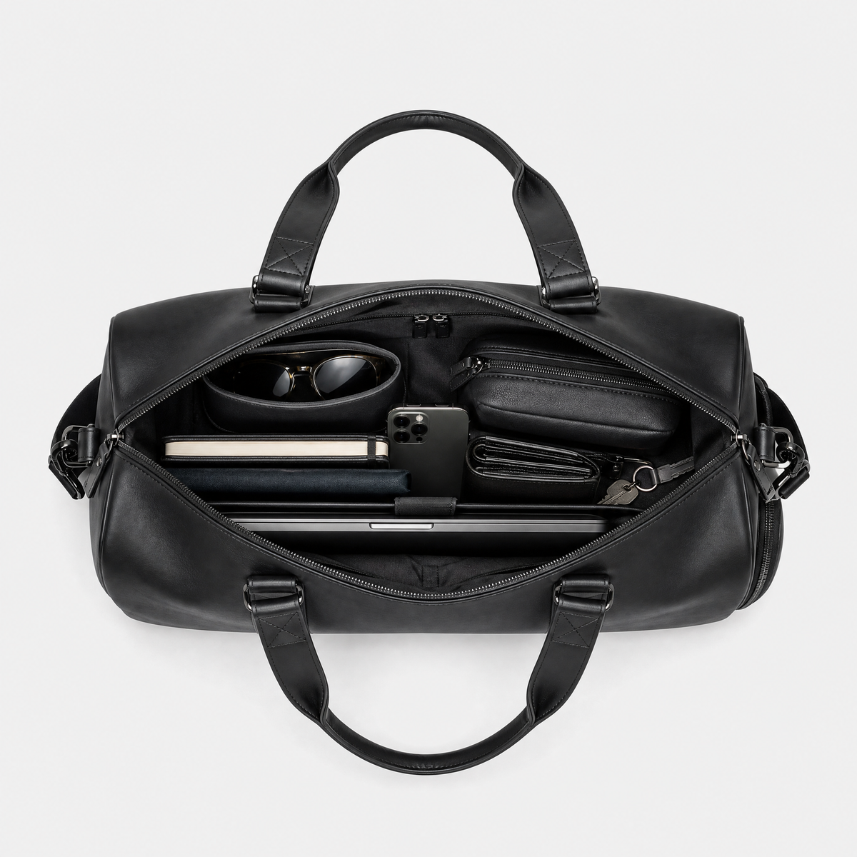 Sac Voyage en Cuir Homme, coloris Noir, sac ouvert avec effets personnels